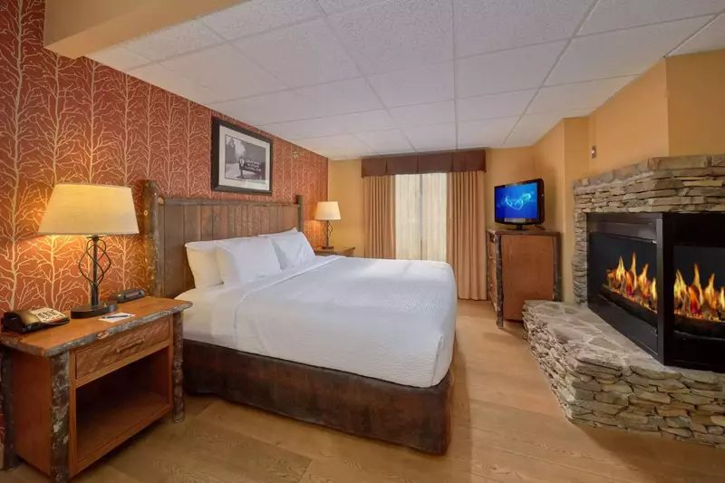 Bed with fireplace in front of it